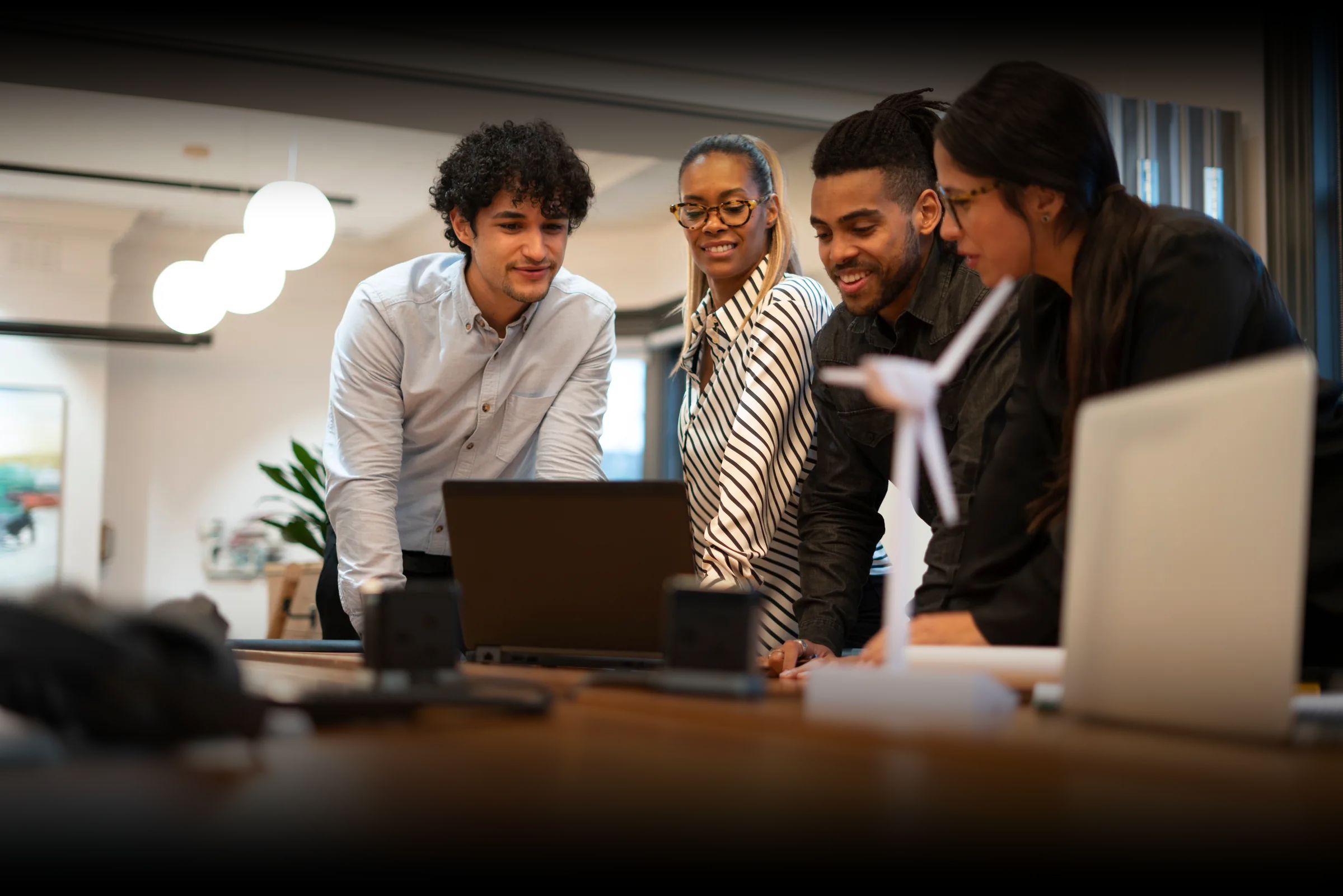 A team collaborating around a wind energy project