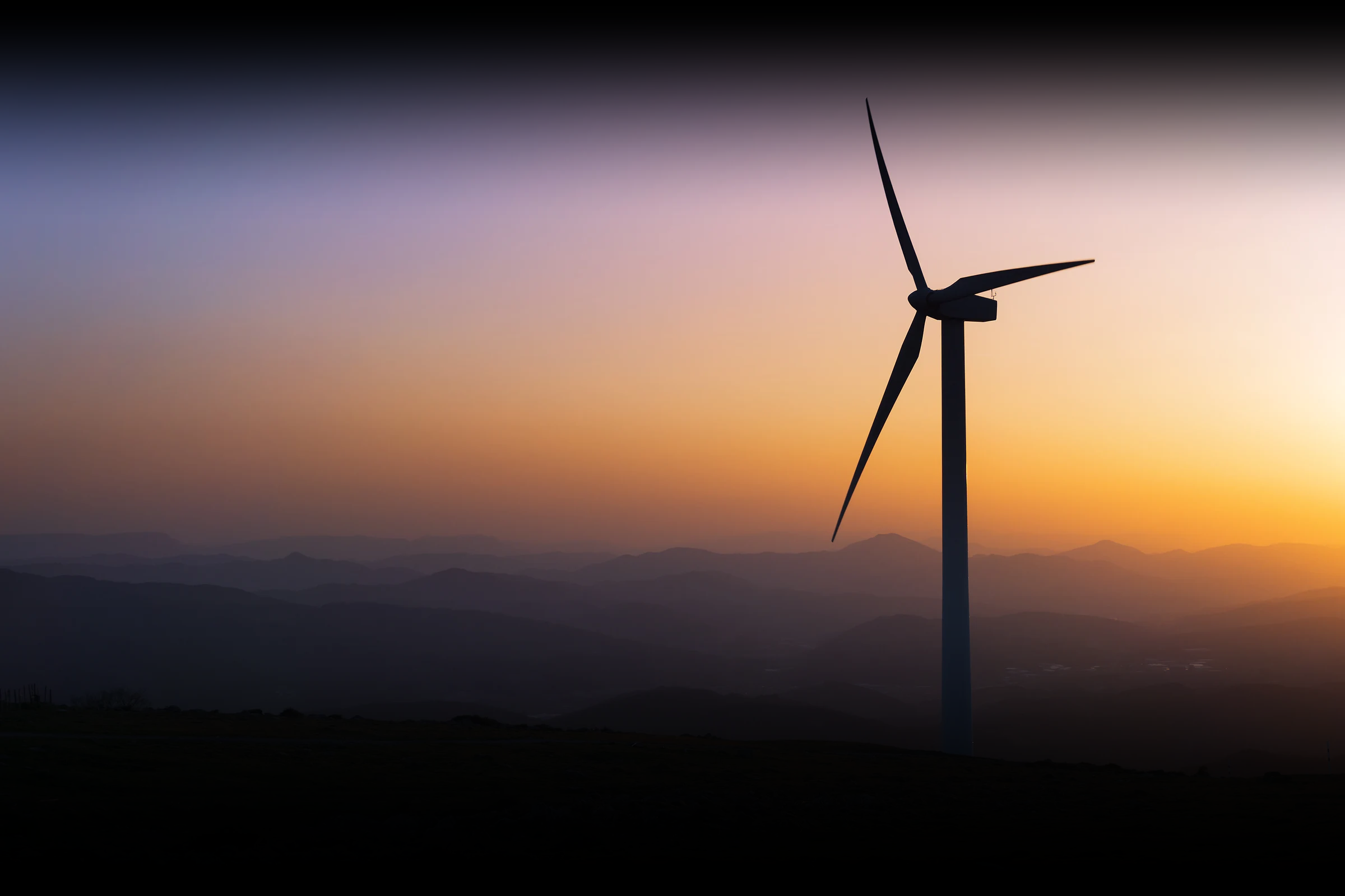 Wind turbine at sunset